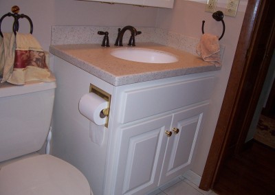 White Vanity with Built-In Toilet Roll Holder