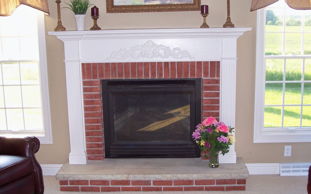 White Mantel and Trim around Brick Fireplace
